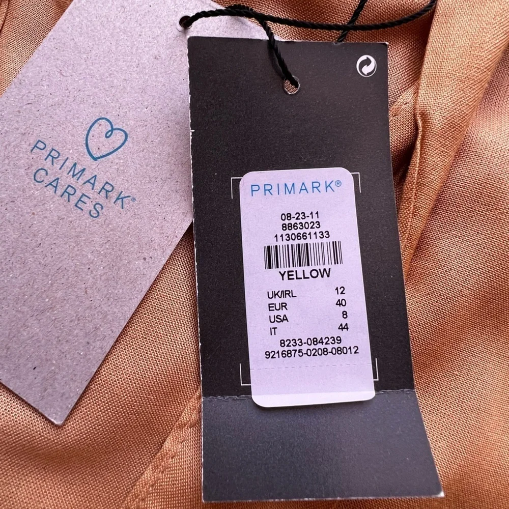Dress shorts, yellow size 8 . PRIMARK CARES